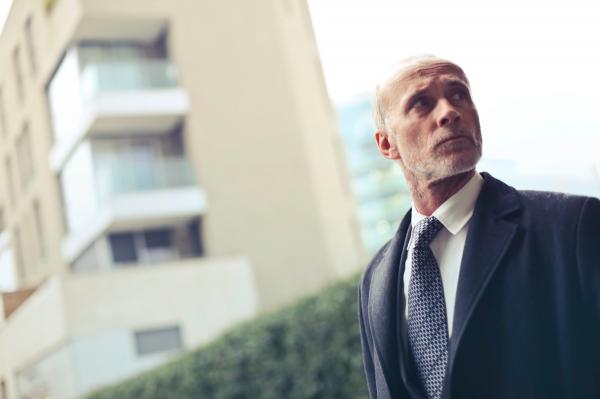 Photo of Old Man Wearing Formal Coat