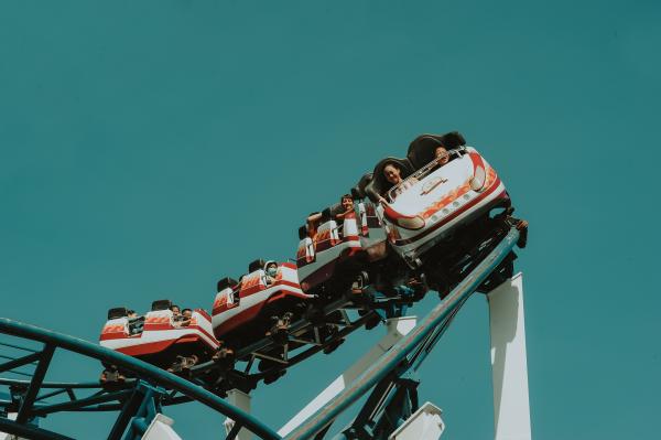 Photo of People Riding Roller Coaster