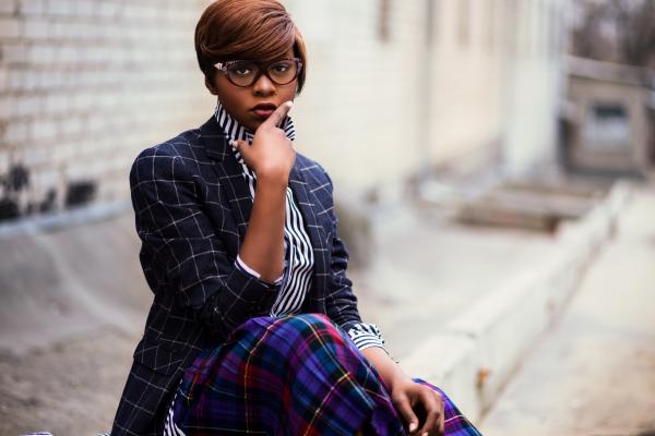 Photo of Woman Holding Her Lips While Sitting
