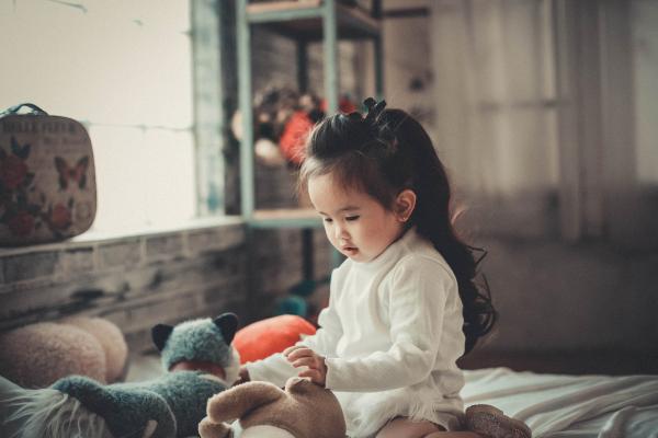 Photography of a Baby Girl Playing