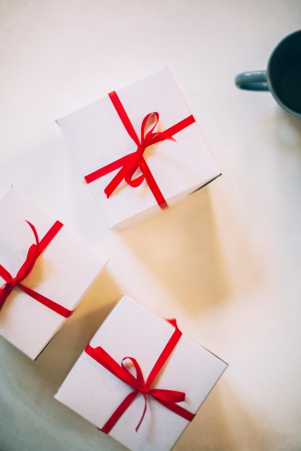 Photography of Three Boxes With Red Ribbons