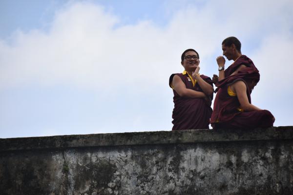 Photography of Three People Talking to Each Other