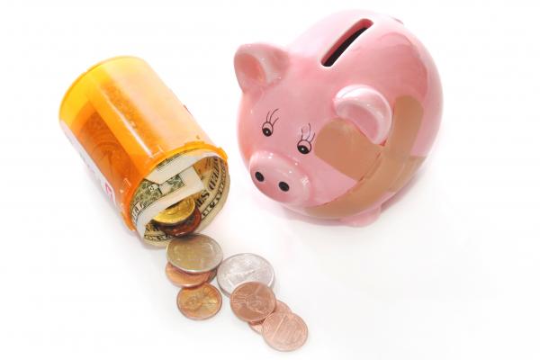 Piggy bank with pill bottle