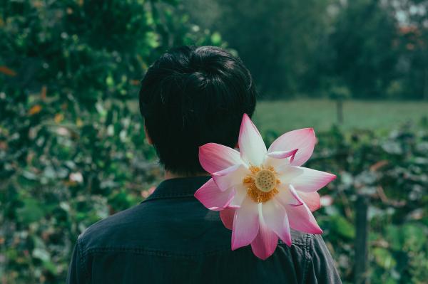 Pink Flowers on the Shoulder of Person