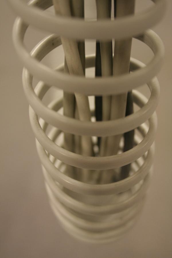 Plastic spring around cables