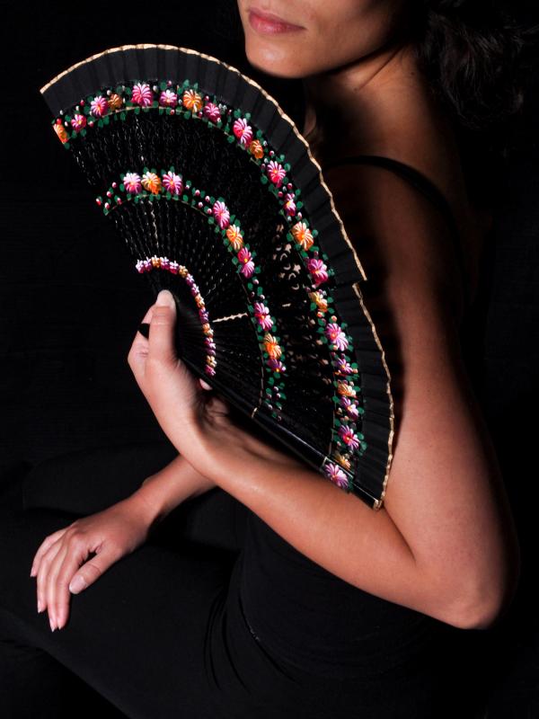 Portrait of woman with fan in hand