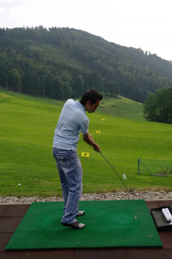 Practicing golf