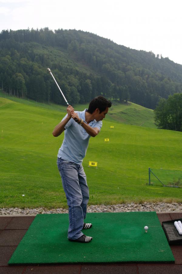 Practicing golf