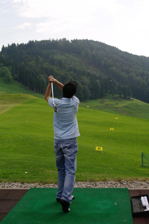 Practicing golf
