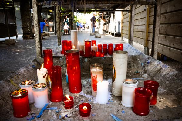 Prayer candles burning in lourdes