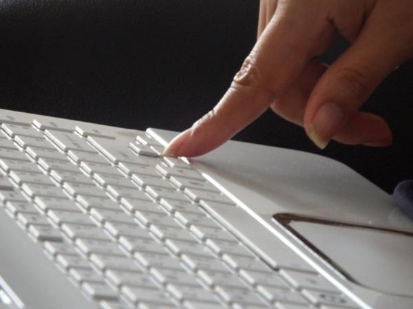 Pressing keys on a laptop keyboard