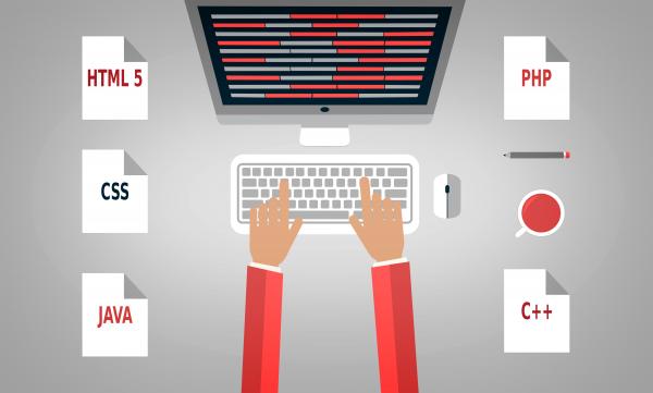 Programmer at the desk with programming languages