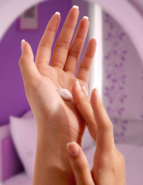 Putting Moisturizer On Her Hands