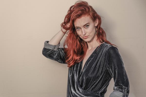 Red Haired Woman in Black Long-sleeved Top