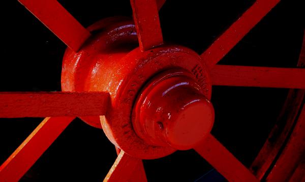 Red spoked wheel.