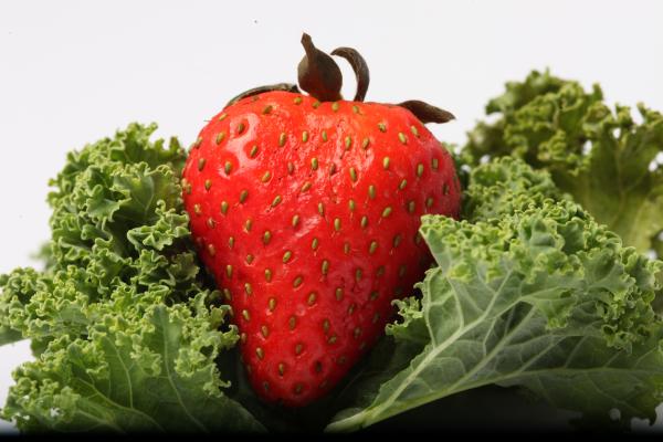 Red Strawberry on kale