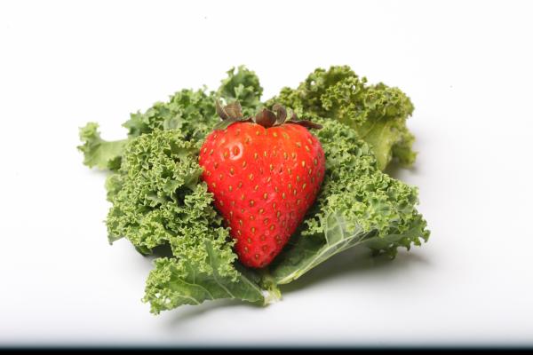 Red Strawberry on kale