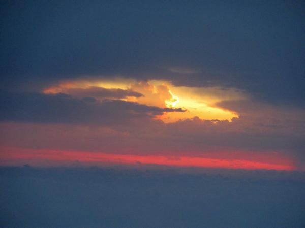 Red sunset in the cloudy sky