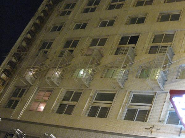 Residential building with fire escape at night in San Francisco