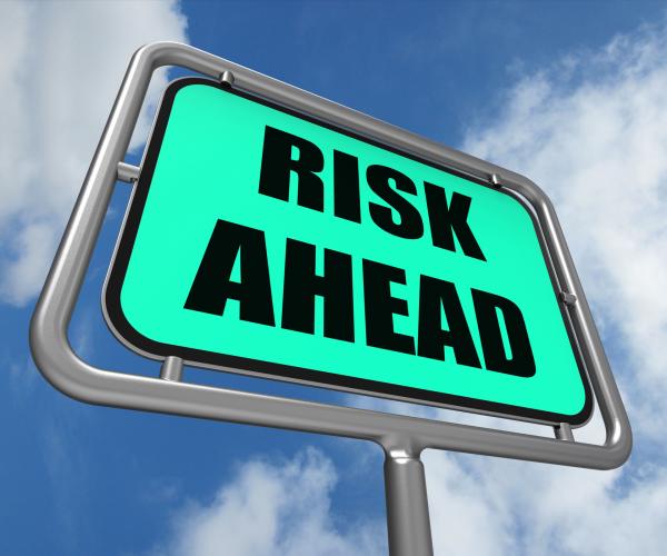 Risk Ahead Sign Shows Dangerous Unstable and Insecure Warning