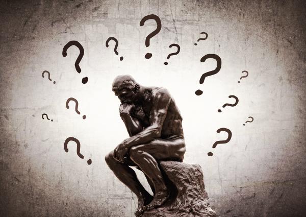 Rodins Thinker surrounded by question marks