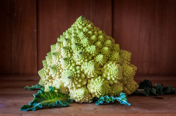 Romanesco broccoli on wooden background