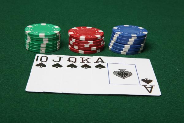 Royal Flush with poker chips.