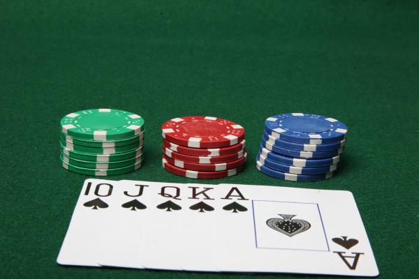 Royal Flush with poker chips.