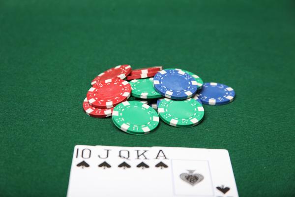 Royal Flush with poker chips.