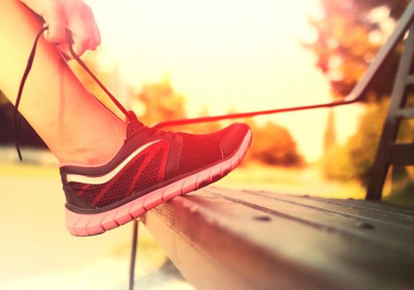 Running Shoes - Woman Tying Shoe Laces