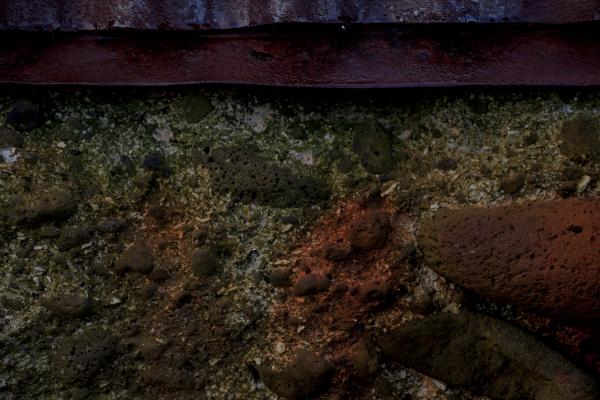 Rust stained concrete wall