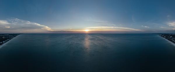 Scenic View of Ocean During Sunset
