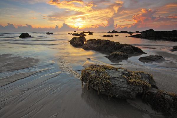 Sea Rock Under White Clouds Blue Skies during Sunset
