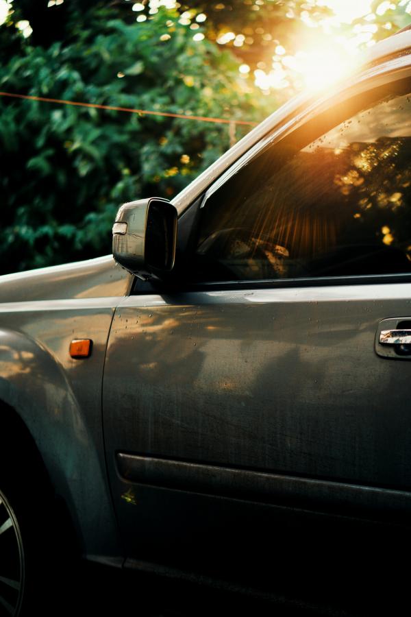Selective Focus Photography of Green Vehicle