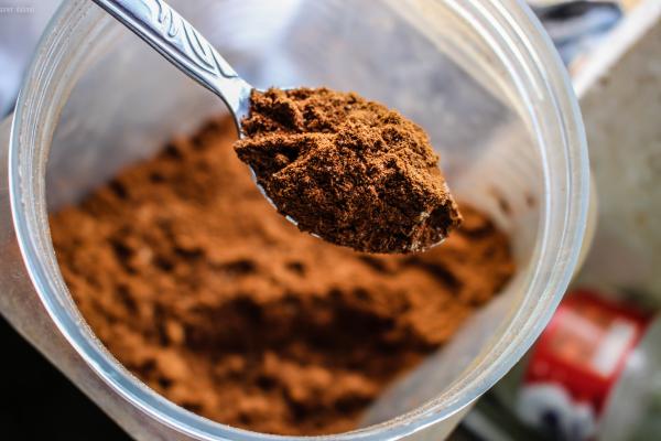 Shallow Focus Photography of Brown Powder on Stainless Steel Tea Spoon