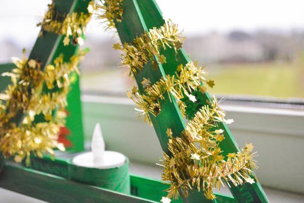 Shallow Focus Photography of Green and Yellow Candle Holder With White Candle