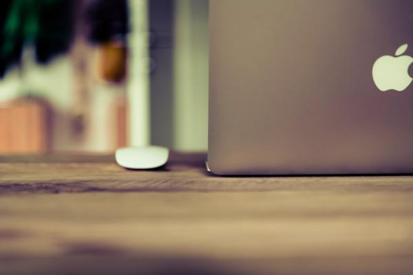 Silver Macbook on Brown Wooden Surface