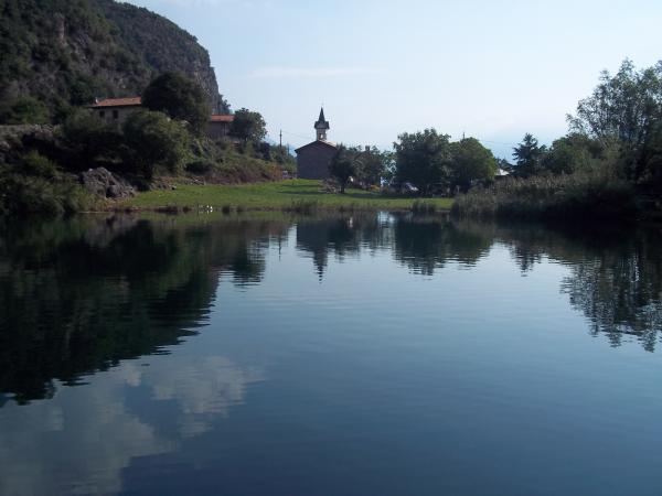 Small church reflected on the lake