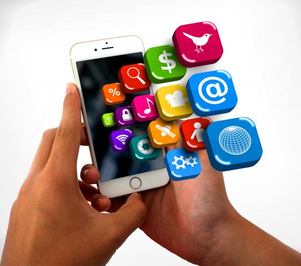 Smartphone on hands with app icons