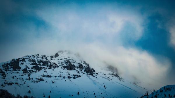 Snow Covered Mountain Under Cloudy Blue Sky