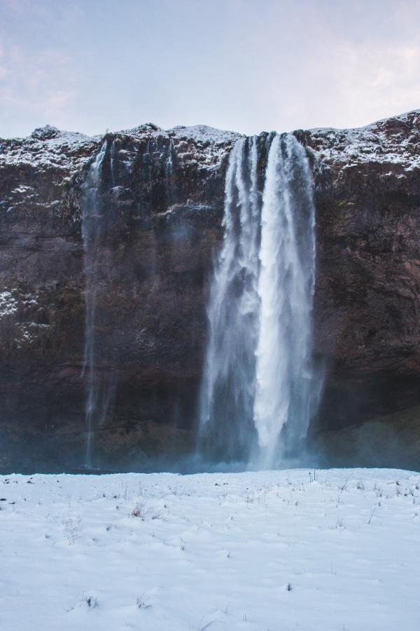 Snow Falling from Cliff Photo