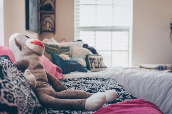Sock Monkey Plush Toy On Bed