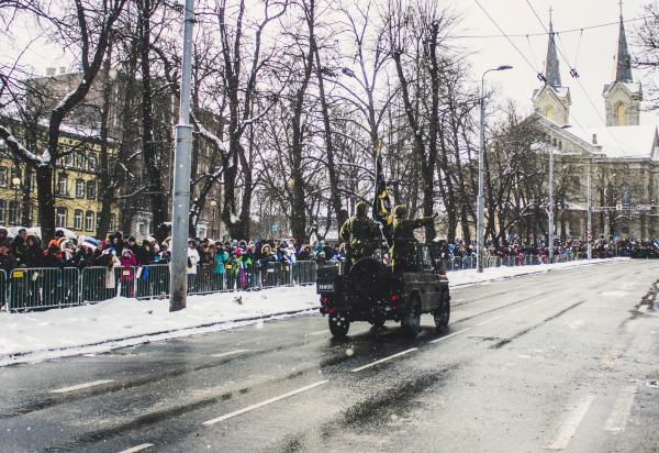 Soldiers Riding a Vehicle during a Parade