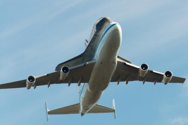 Space Shuttle Endeavour and carrier plane passing directly overhead in Marin Headlands