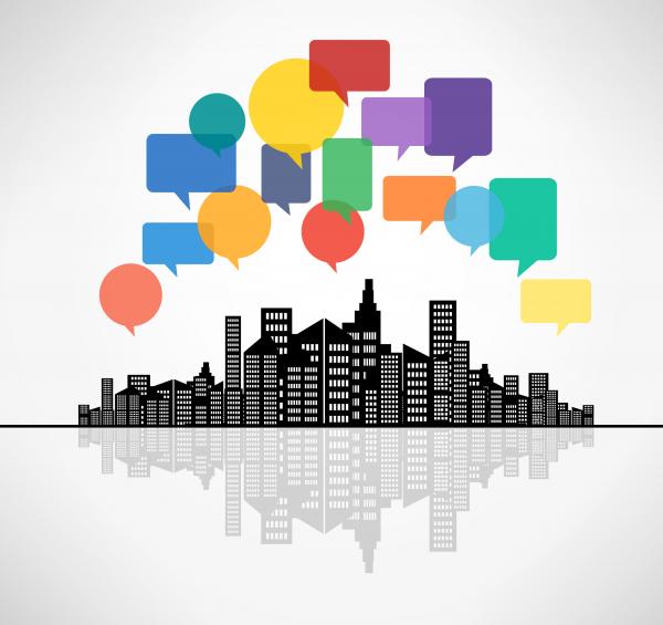 Speech bubbles above the city