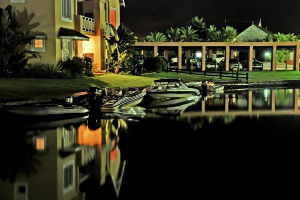 Speed Boats Docked Near House