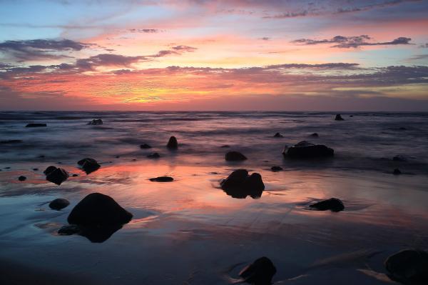 Stones on Body of Water during Golden Hour