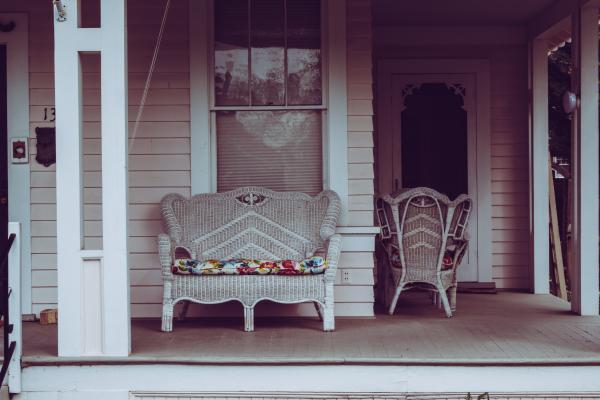 Stylish terrace with wicker furniture