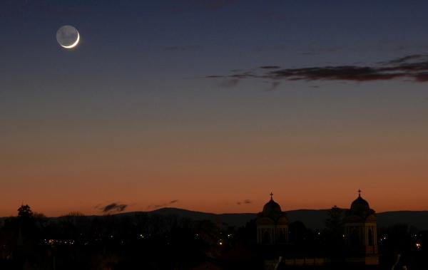 Sunrise with crescent moon