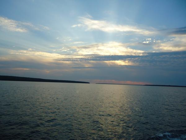Sunset behind clouds on superior